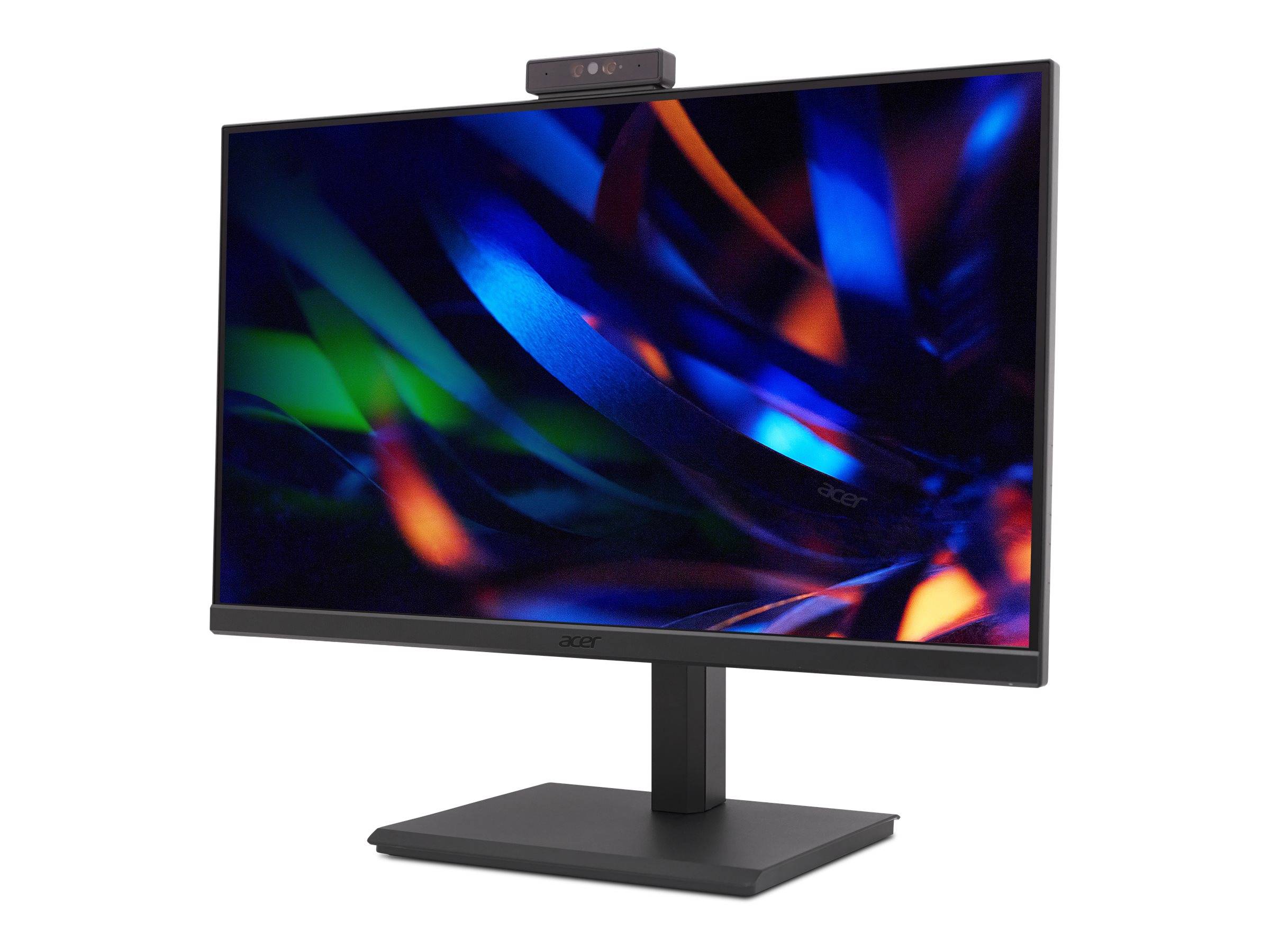 Ein Desktop-Monitor mit integrierter Webcam oben, der auf schwarzem Hintergrund ein buntes abstraktes Lichtmuster anzeigt.