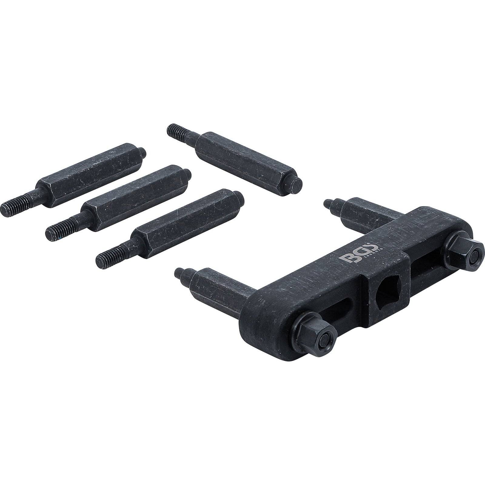 Ein Satz aus fünf schwarzen Bohrern mit einem Gewindebohrer-Ausbohrzubehör, entwickelt zum Entfernen abgebrochener Befestigungselemente. Das Werkzeug verfügt über eine robuste, metallische Konstruktion.