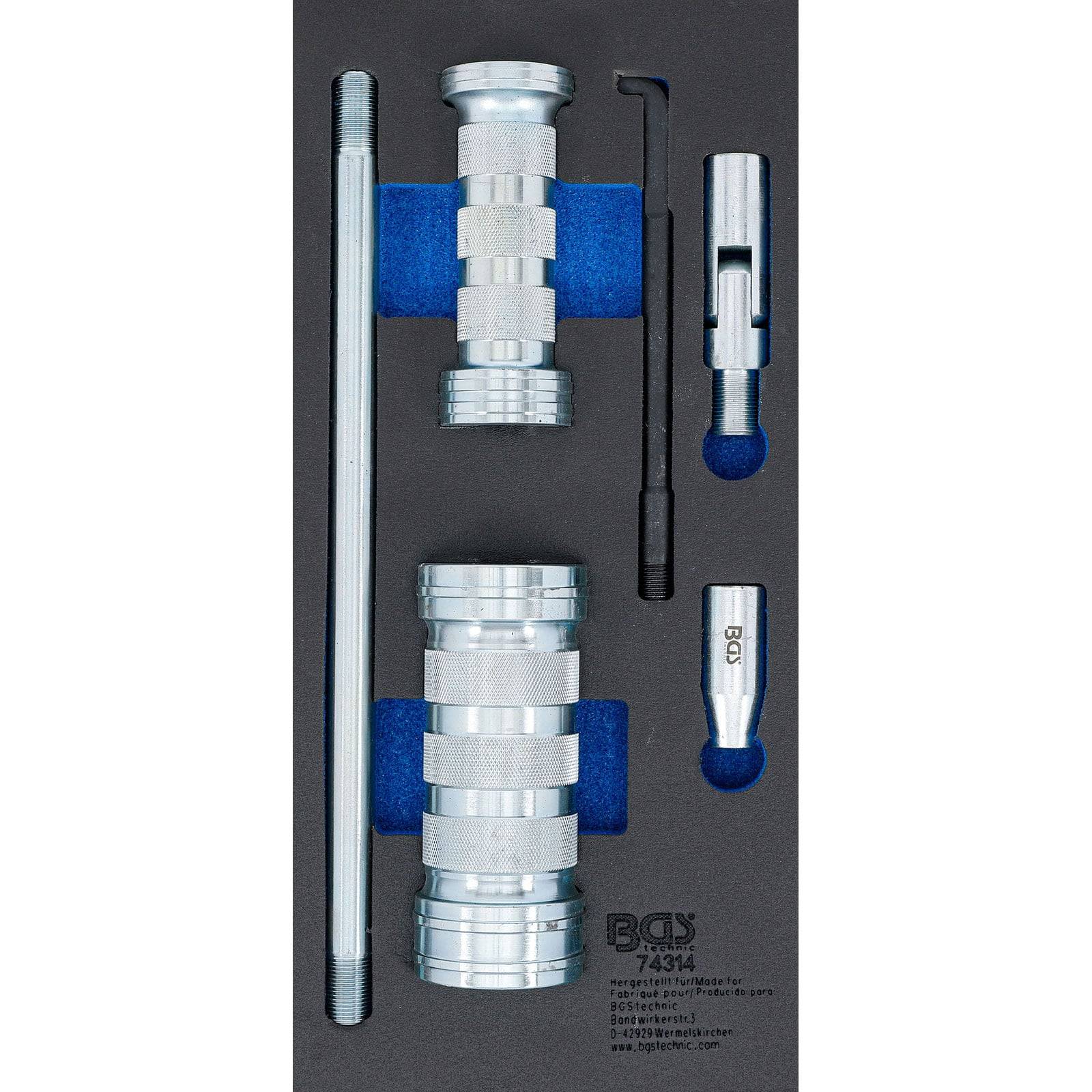 Ein Metallwerkzeugsatz in einem Schaumhalter, der zylinderförmige Komponenten und Stäbe umfasst. Jedes Teil ist in einer maßgeschneiderten blauen Schaumauskleidung befestigt.