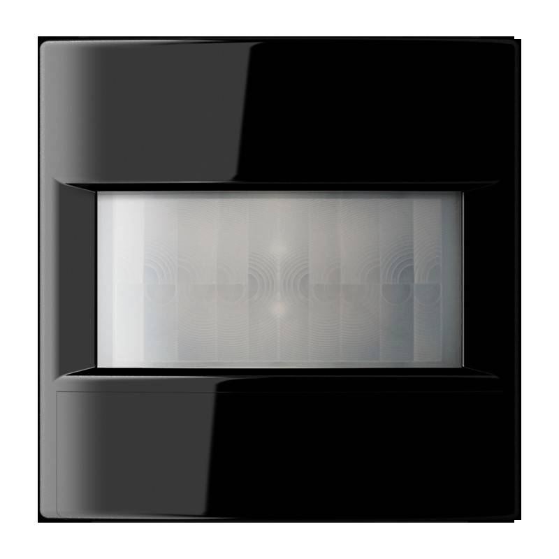 Ein schwarzer Bewegungssensorschalter mit einer weißen, rechteckigen Detektionsfläche in der Mitte. Das Design ist modern und minimalistisch.