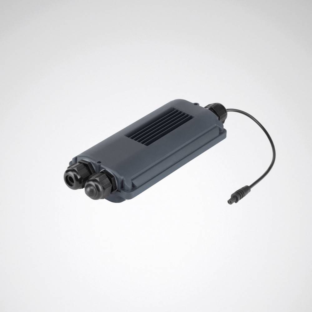 Ein grauer elektronischer Apparat mit zwei Kabelanschlüssen an einem Ende und einem einzelnen angeschlossenen Kabel am anderen Ende, wahrscheinlich zur Kommunikation oder Stromversorgung verwendet.