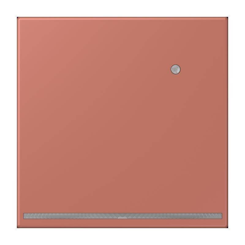Ein quadratisches, lachsfarbenes Wandpanel mit einem kleinen kreisförmigen Knopf nahe der oberen rechten Ecke und einem horizontalen Streifen in der unteren Hälfte.