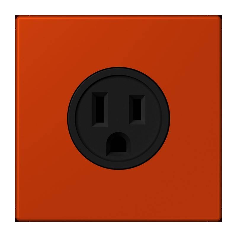 Ein rotes Quadratpanel mit einer schwarzen Steckdose, die zwei vertikale Schlitze und ein rundes Loch darunter aufweist.
