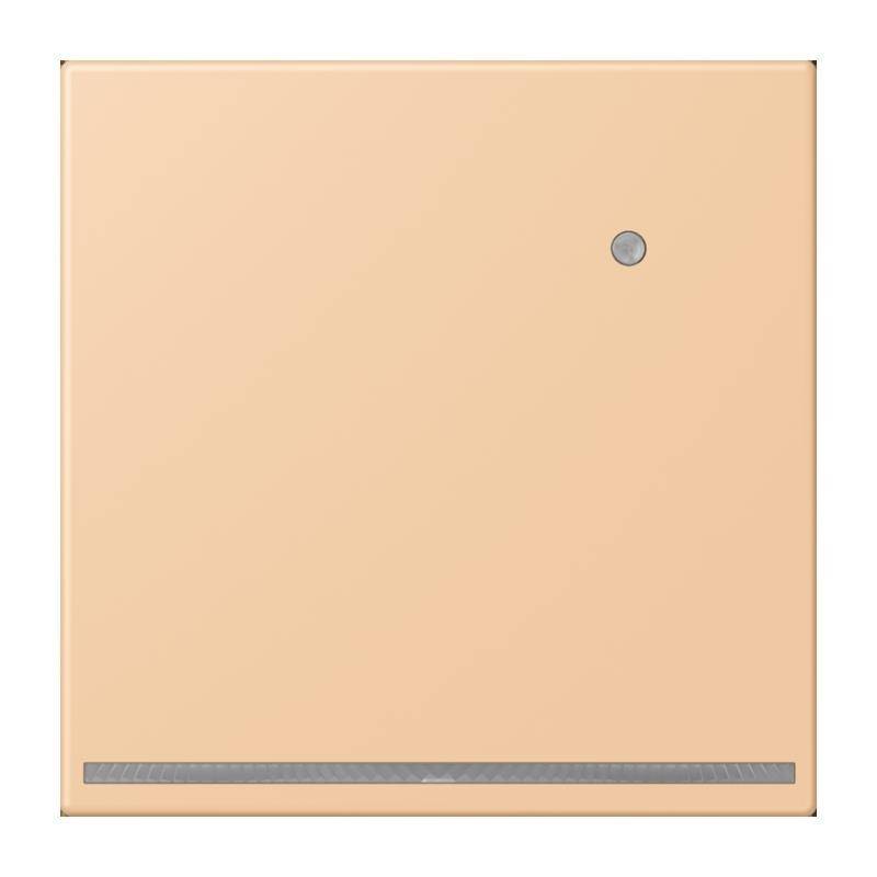 Ein beiges quadratisches Objekt mit einem kleinen kreisförmigen Knopf in der oberen rechten Ecke und einem dünnen schmalen Streifen nahe der unteren Kante.