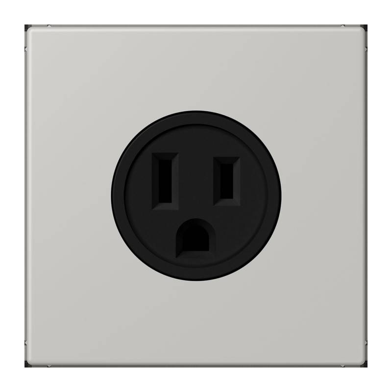 Eine schwarze, runde elektrische Steckdose, die an einer einfarbigen grauen Wand montiert ist.