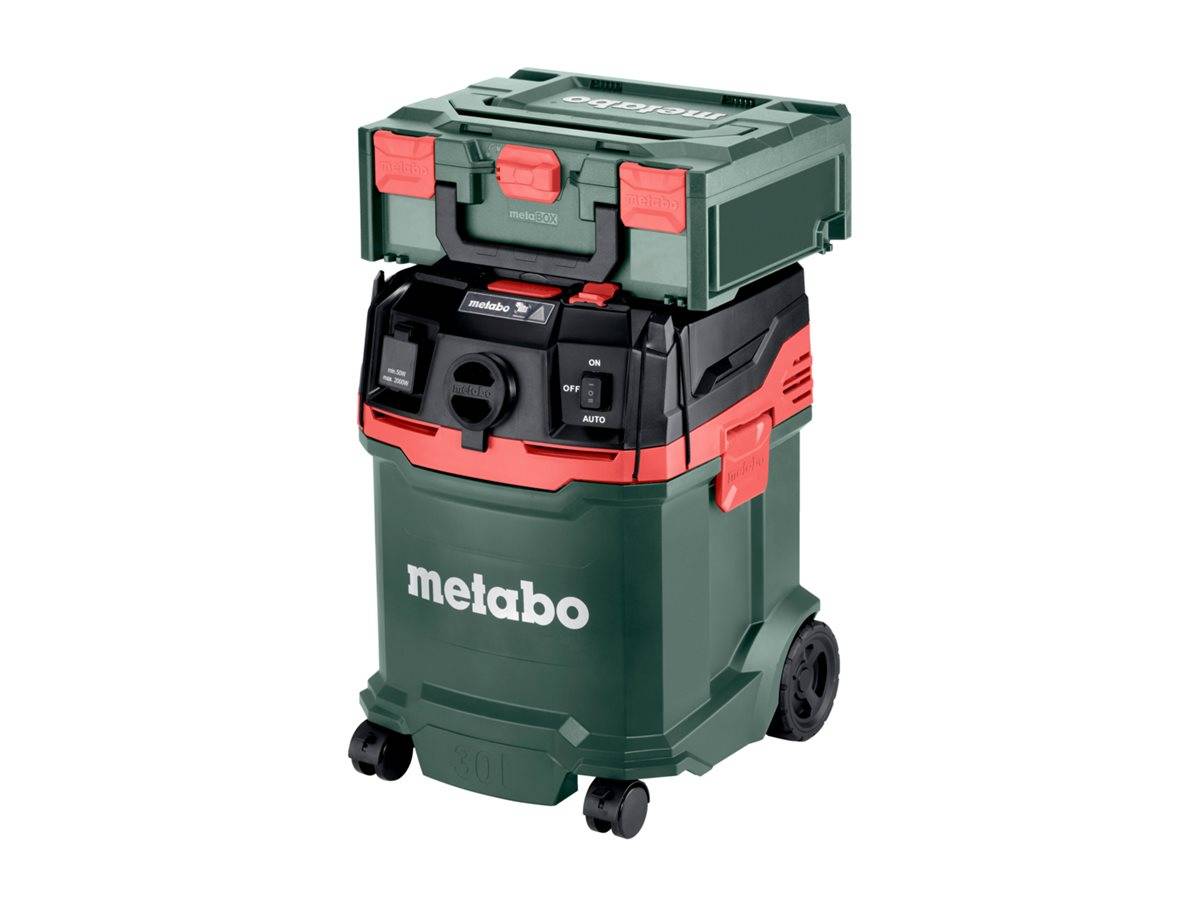 Ein grüner und roter Metabo-Staubsauger mit Rädern, mit einem Bedienfeld mit den Optionen "ON"", ""OFF"" und ""AUTO"" sowie einer Aufbewahrungsbox oben.