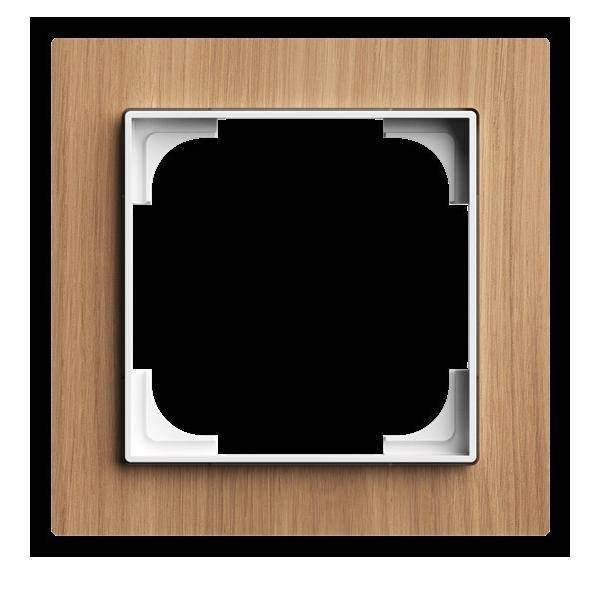 Eine Holz-Lichtschalterabdeckung mit einem zentralen schwarzen Quadrat und einem weißen Rand, die für dekorative oder schützende Zwecke vorgesehen ist.