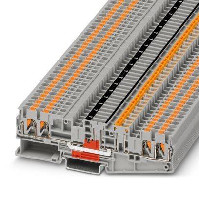 Ein modulares Klemmleistenmodul in Grau und Orange, das mehrere Anschlusspunkte und Kanäle zur Organisierung von elektrischen Leitungen zeigt.