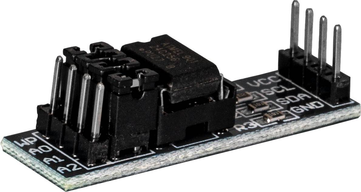 Nahaufnahme einer schwarzen elektronischen Komponente auf einer Leiterplatte mit einem kleinen rechteckigen Chip und anderen elektronischen Steckverbindern.