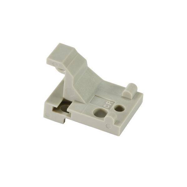 Eine hellgraue Kunststoffkomponente mit zwei kreisrunden Löchern und einem erhabenen Abschnitt, höchstwahrscheinlich eine Verbindungs- oder Befestigungshalterung.