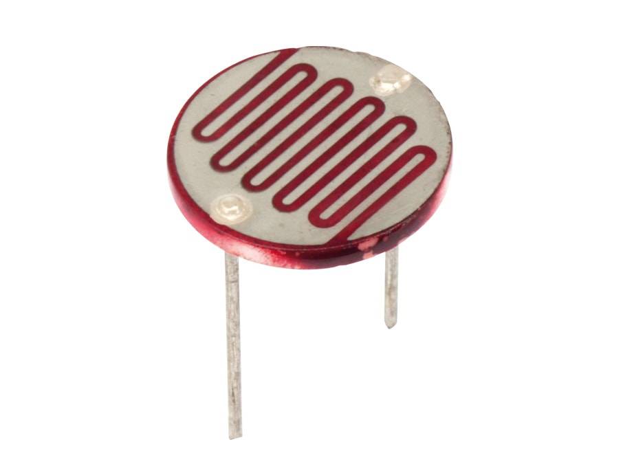 Ein runder Fotowiderstand mit einer weißen Oberfläche und rotem Zickzack-Muster, mit zwei Metallbeinen zur Verbindung in elektronischen Schaltungen.