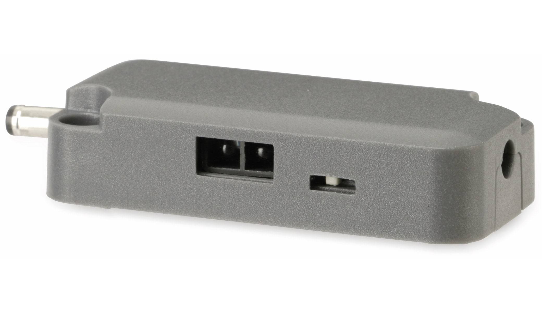 Eine Nahaufnahme von Anschlüssen an elektronischen Geräten, mit einer rechteckigen Stromsteckdose und einem dünnen, länglichen Schlitz, wahrscheinlich für Verbindungszwecke.