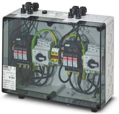 Eine transparente Elektroverteilerdose enthält mehrere Sicherungsautomaten und Kabel und deutet auf einen Aufbau zur Stromverteilung und -steuerung hin.