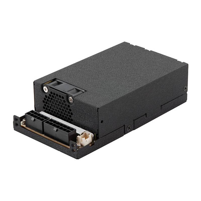 Eine schwarze Computerkomponente, möglicherweise eine Stromversorgungseinheit (Netzteil) oder ein internes Laufwerk, mit sichtbaren Steckverbindern und belüftetem Bereich.