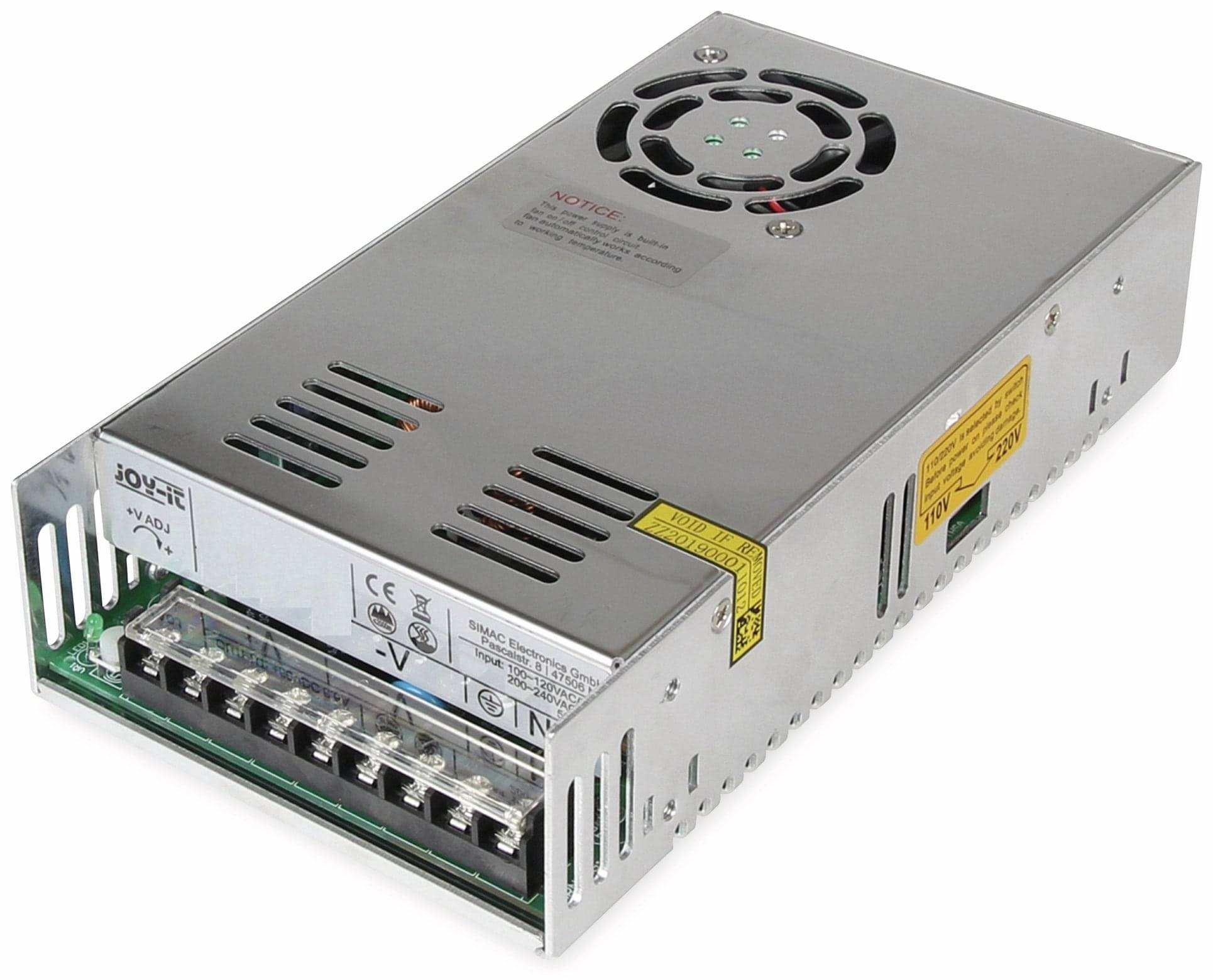 Eine silberfarbene Stromversorgungseinheit aus Metall mit einem Lüfter oben, mehreren Anschlüssen an der Seite und Warnhinweisen in Schwarz und Gelb.