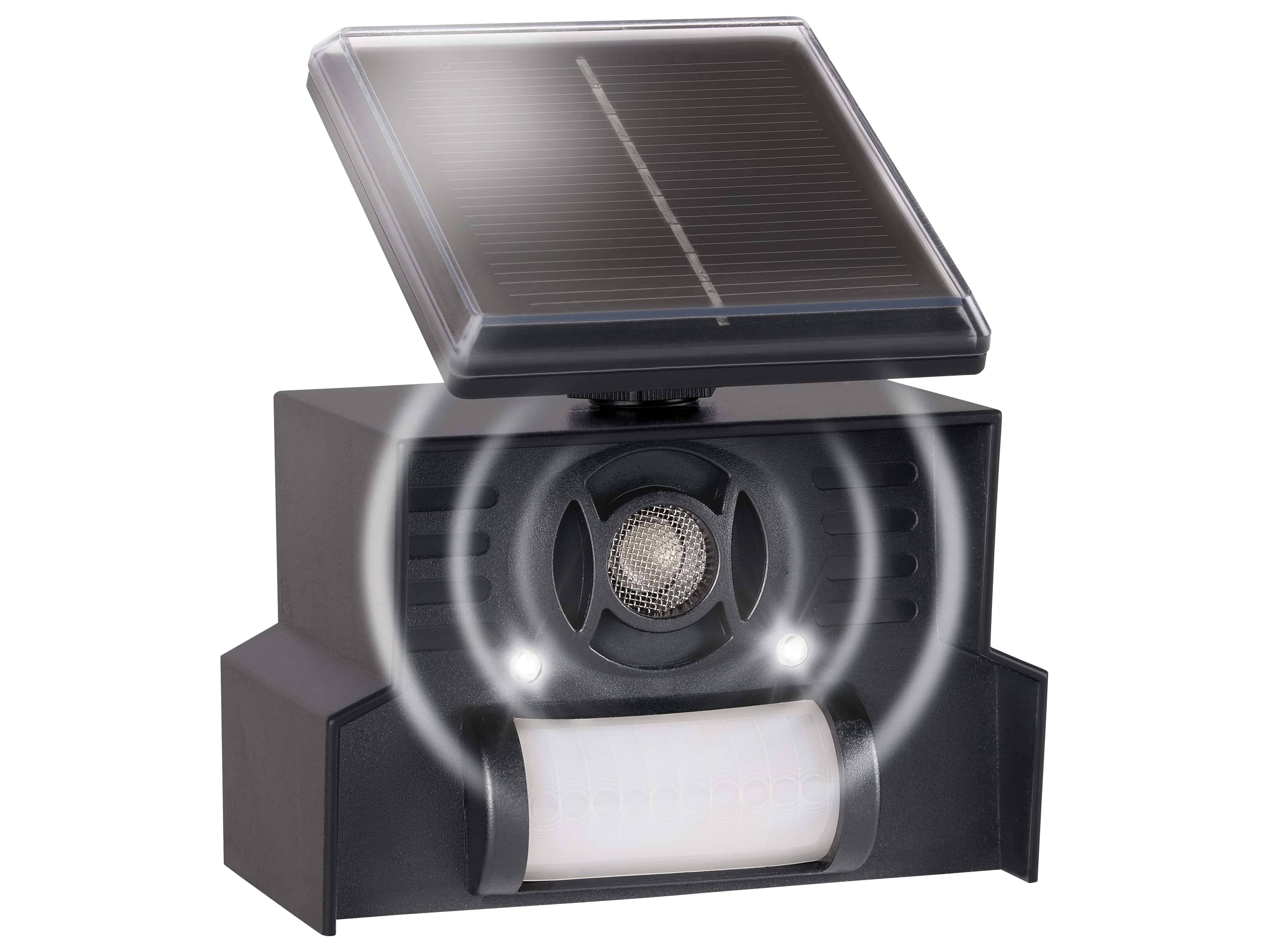 Ein solarbetriebener Ultraschall-Schädlingsvertreiber mit einem Lautsprecher und LED-Leuchten, eingebaut in einem schwarzen Gehäuse.