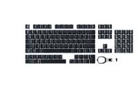 Satz schwarzer Tastaturkeycaps mit einem Keycap-Abzieher, separat für Austausch oder Anpassung angeordnet.