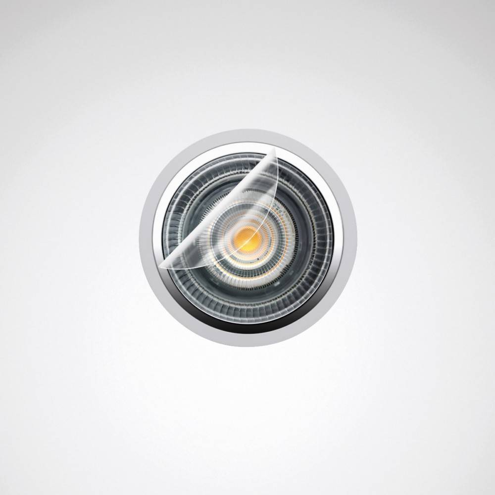 Eine kreisförmige mechanische linsenähnliche Struktur mit komplizierten Details in der Mitte, die wie eine futuristische Kamera oder ein Auge aussieht, vor einem schlichten Hintergrund.