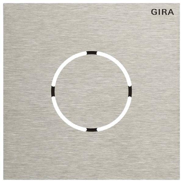 Gira-Metall-Drucktastenschalter mit minimalistischem kreisförmigem Design und dezenten Schwarz-Weiß-Akzenten auf matter Oberfläche.