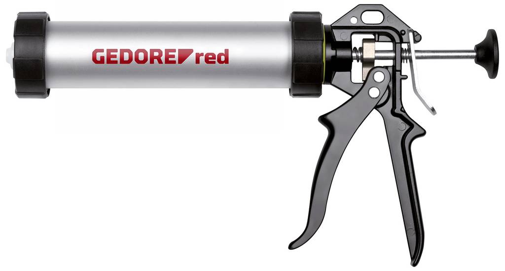 Handgehaltene Fugenpistole mit einer silbernen Kartuschenhülse „GEDORE red