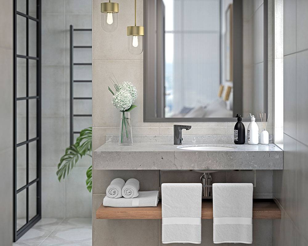Modernes Badezimmerschränkchen mit Waschbecken, großem Spiegel, Wandleuchten, Handtüchern und Toilettenartikeln, neben einer Glasduschabtrennung zu sehen.