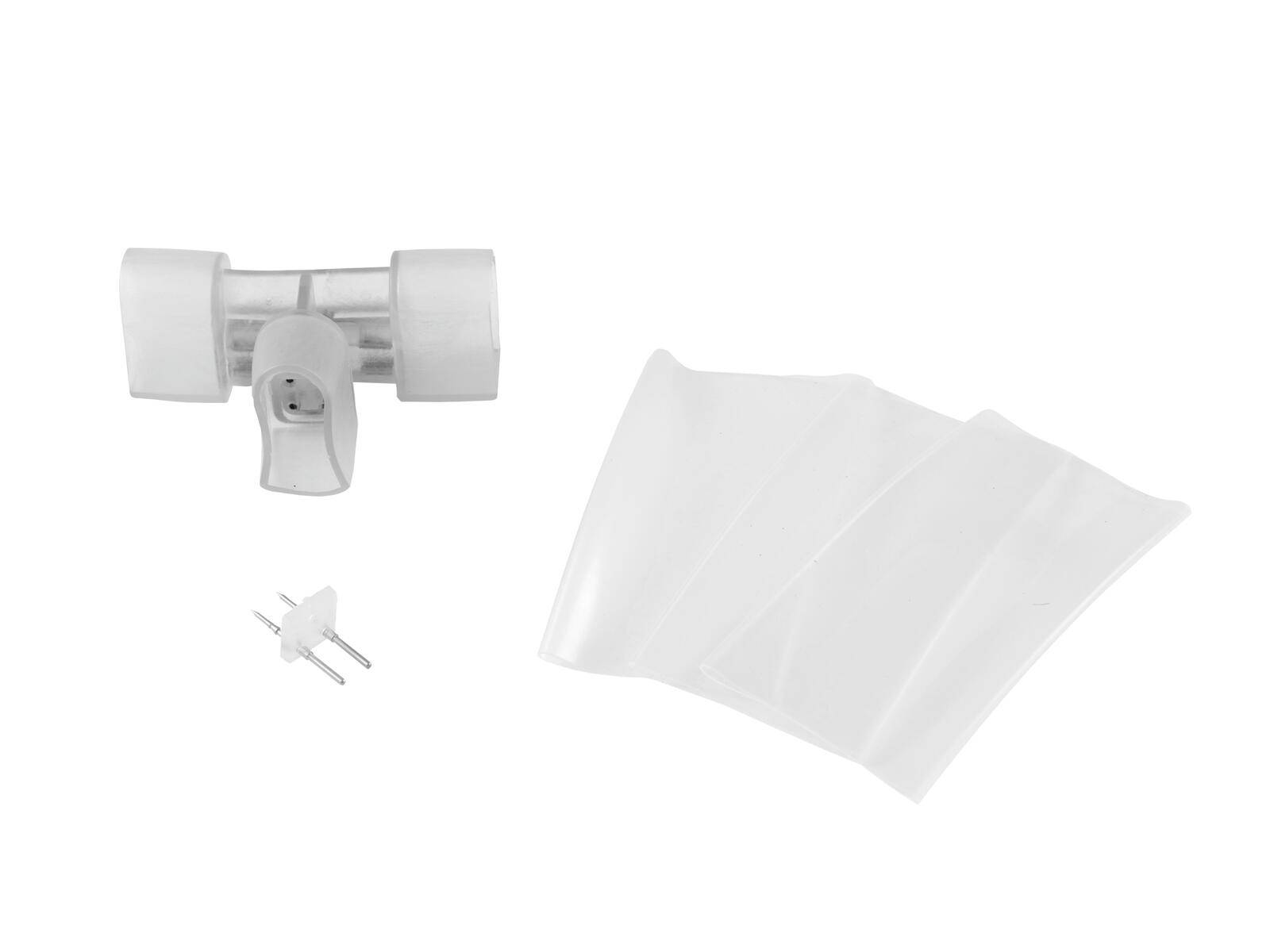 Ein T-förmiger Stecker mit einem Stromstecker-Adapter und zwei durchsichtigen Kunststofffolien, wahrscheinlich Komponenten für eine spezifische Montage oder Reparatur.