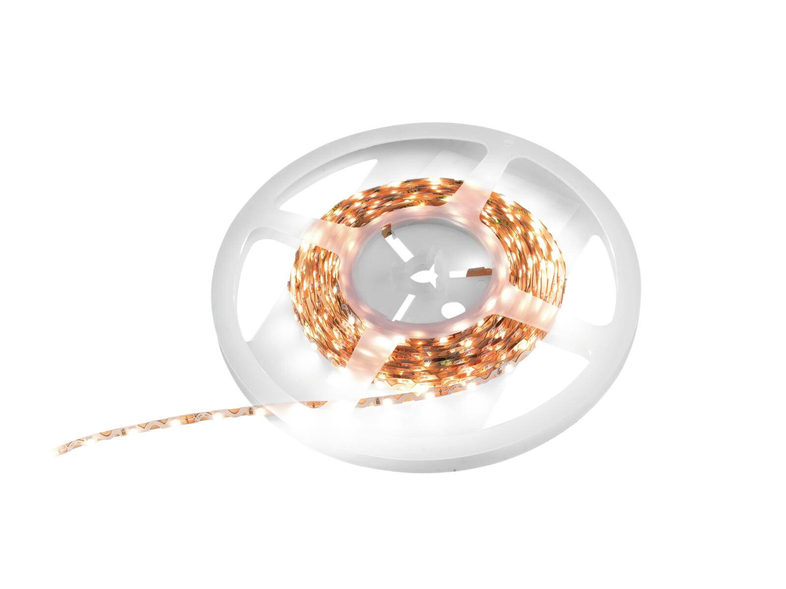 Eine Rolle LED-Streifenleuchten, aufgewickelt auf einer weißen Kunststoffspule, gibt ein warmes Licht ab und wird für dekorative Beleuchtung oder Akzentbeleuchtung verwendet.