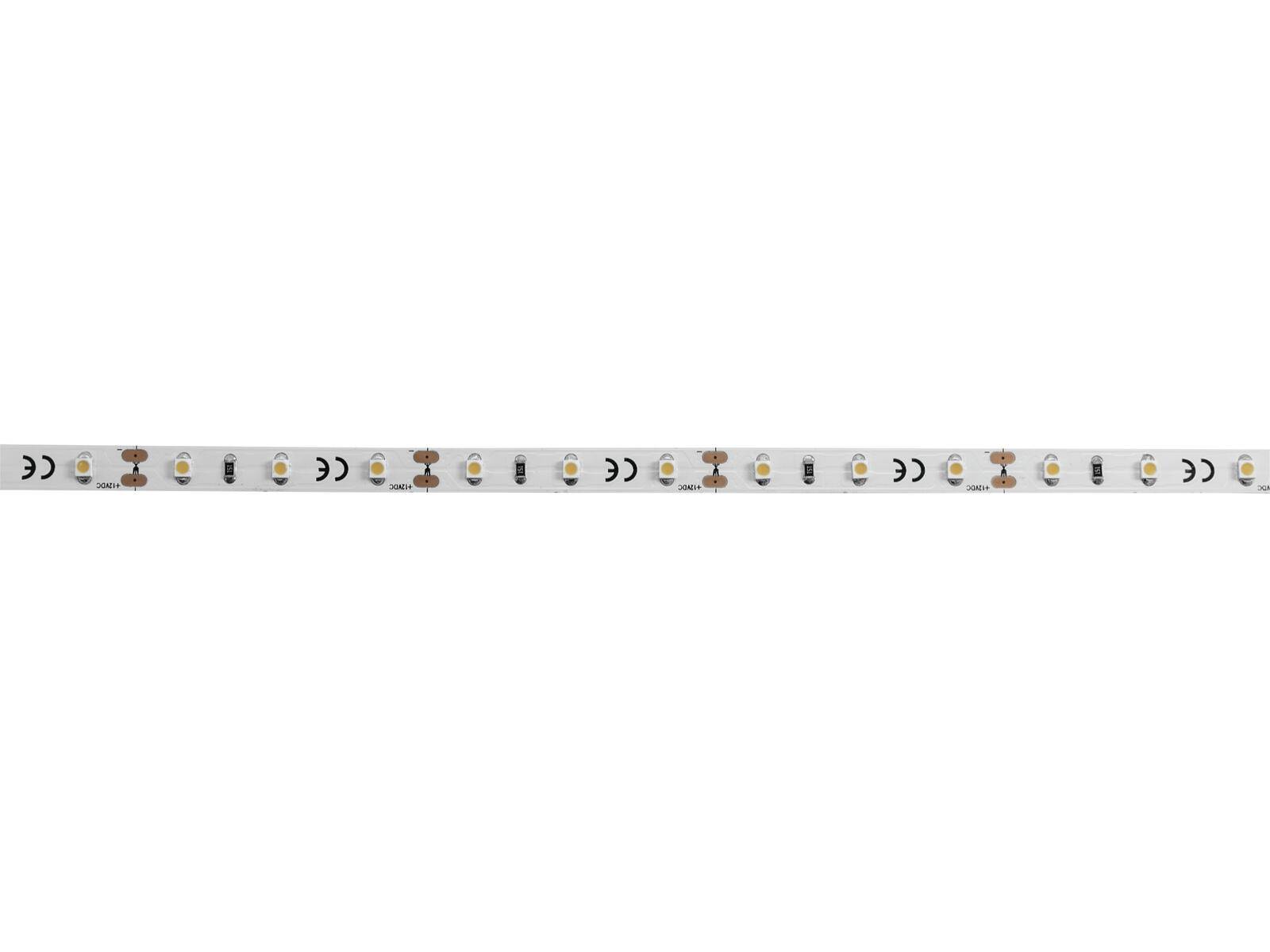 Nahaufnahme eines weißen LED-Streifens mit gleichmäßig verteilten kleinen kreisförmigen LEDs und kleinen Schaltkomponenten dazwischen.