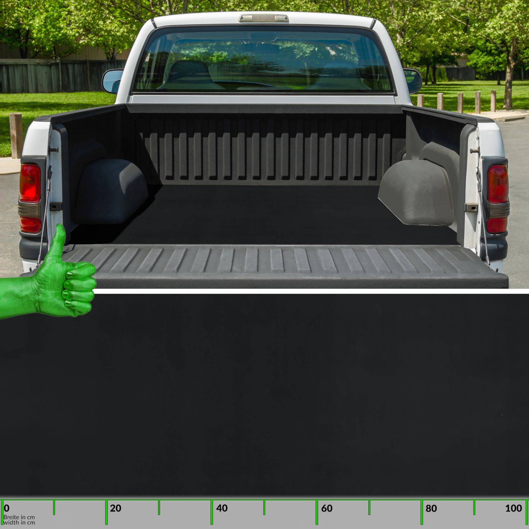 Leere Ladefläche eines Pickup-Trucks mit einem grünen Daumen-hoch-Symbol und einer Messstabskala am unteren Rand mit der Beschriftung 0 bis 100.