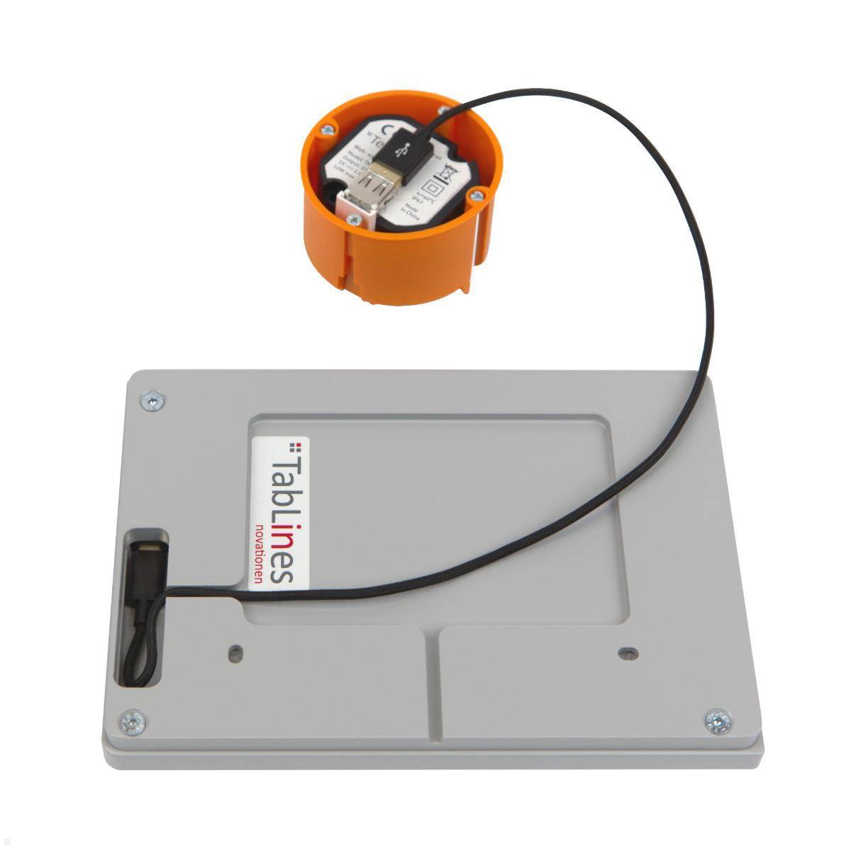 Eine TabLines drahtlose Ladestation mit einem abnehmbaren Empfänger, der über ein Kabel verbunden ist, die die Produktkomponenten und das Design präsentiert.