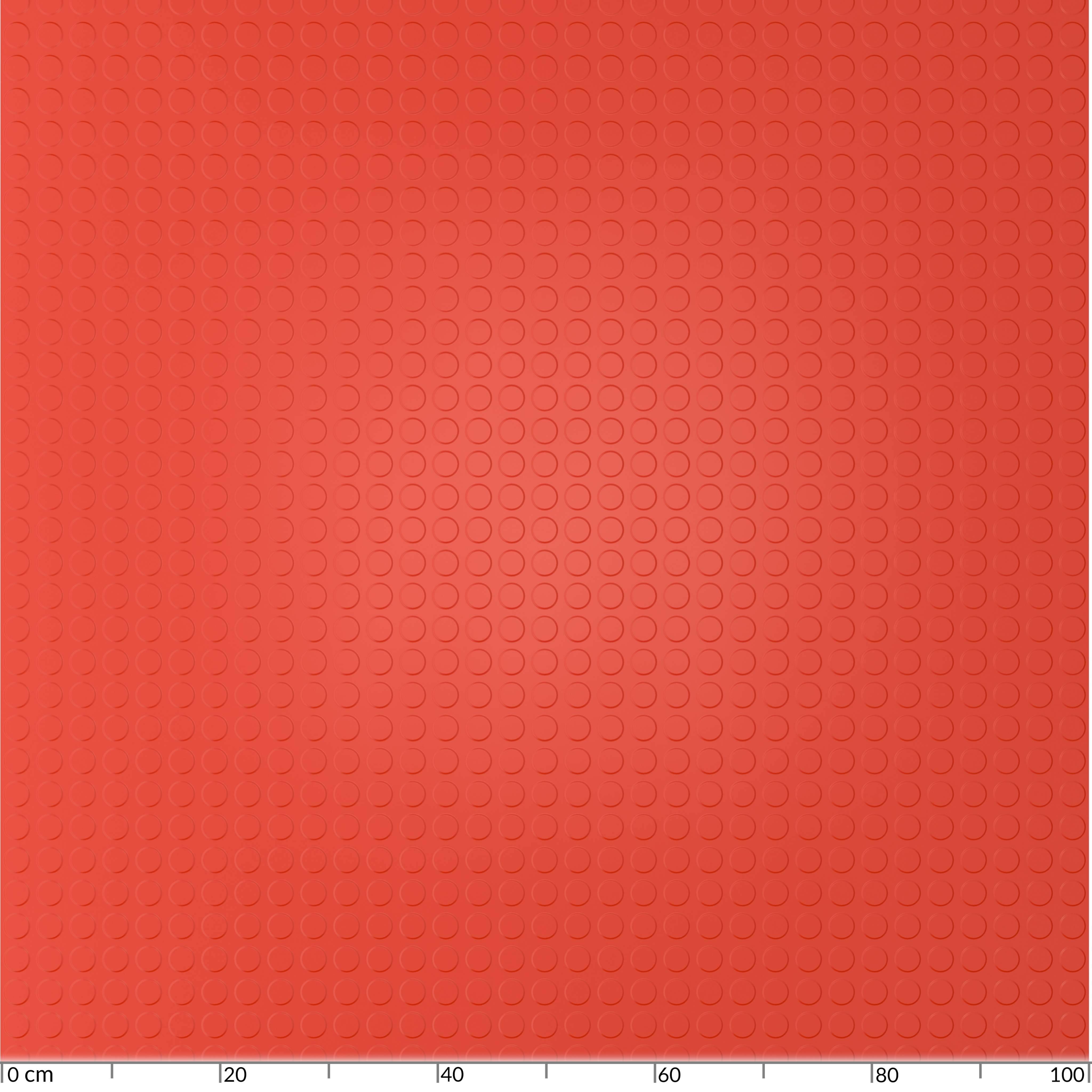 Rote strukturierte Oberfläche mit gleichmäßig verteilten kreisförmigen Vertiefungen, dargestellt gegen eine Zentimeterskala am unteren Rand.