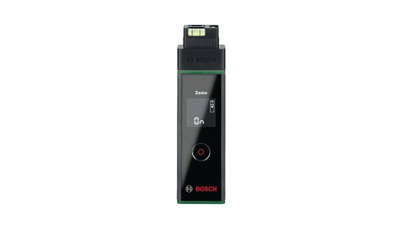 Bosch Zamo Lasermessgerät mit digitalem Display, das 0m anzeigt. Schwarz mit grünen Akzenten und einem roten Knopf unterhalb des Bildschirms.