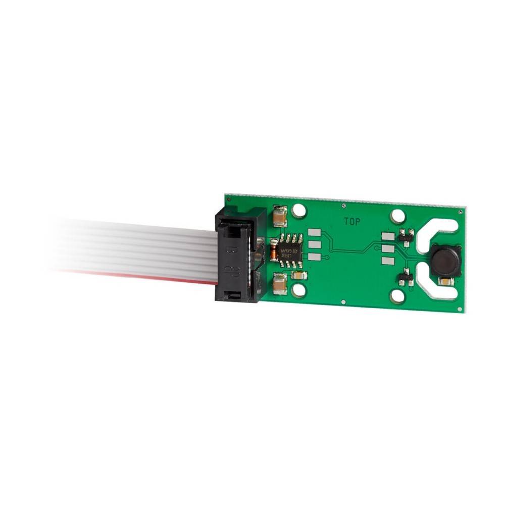 Kleine grüne elektronische Sensorplatine mit einem Flachbandkabel-Anschluss und einer schwarzen knopfartigen Komponente auf der rechten Seite.