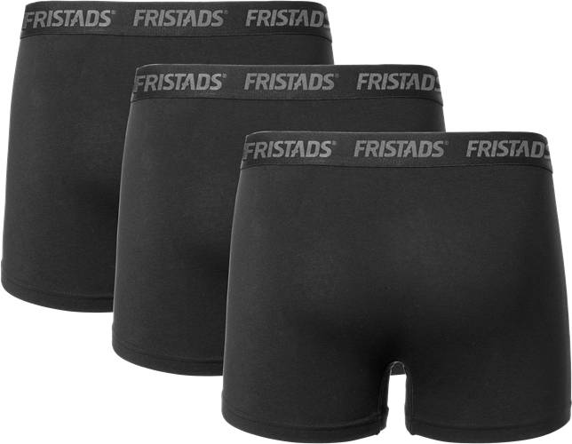 Drei Paare schwarzer Fristads Boxershorts sind in versetzter Reihe vor einem schwarzen Hintergrund angeordnet, wobei der elastische Bund mit Markenbeschriftung sichtbar ist.