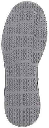 Das Bild zeigt das strukturierte Muster auf der Sohle eines grauen Schuhs mit miteinander verbundenen sechseckigen Formen für besseren Grip.