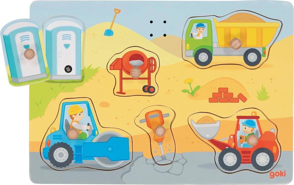 Ein farbenfrohes Kinderpuzzle, das eine Baustelle mit einem Bagger, einer Betonmischmaschine, einem Kipper und einer Mobiltoilette auf sandigem Gelände darstellt.