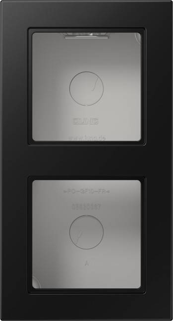 Eine Nahaufnahme einer schwarzen elektrischen Schalttafel mit zwei quadratischen Tasten. Jede Taste verfügt über ein Symbol und Text, der die Funktionalität anzeigt.