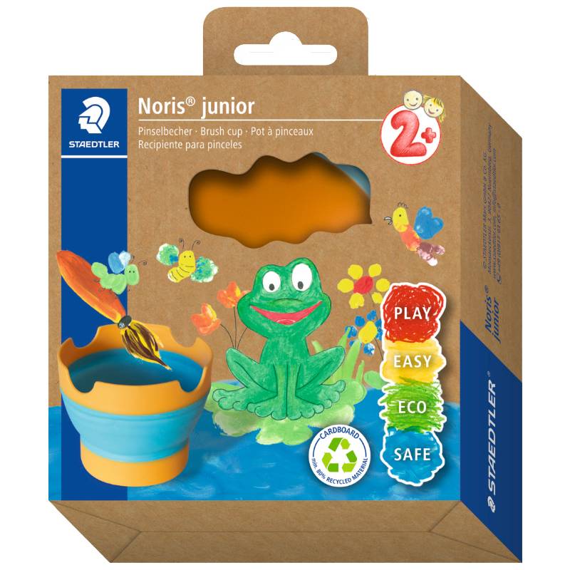 Staedtler Noris junior Pinselbecher-Verpackung mit einer bunten Frosch- und Blumenillustration, gekennzeichnet mit 'SPIELEN', 'EINFACH', 'ÖKOLOGISCH', 'SICHER', geeignet für Kinder ab 2 Jahren.