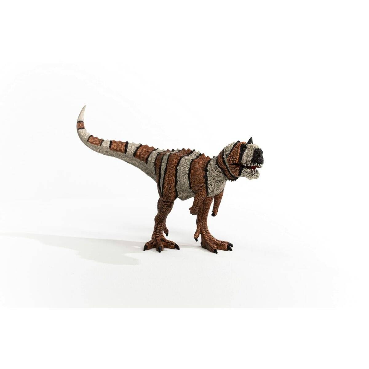 Spielzeug-Dinosaurier-Figur im Profil auf einem schlichten weißen Hintergrund, ähnelt einem gestreiften T. rex.