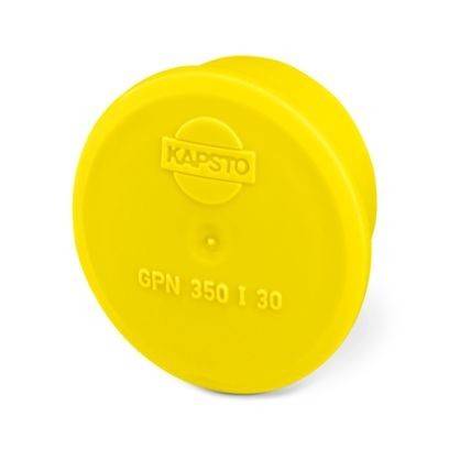 Eine gelbe Kunststoffkappe mit der eingeprästen Aufschrift „KAPSTO