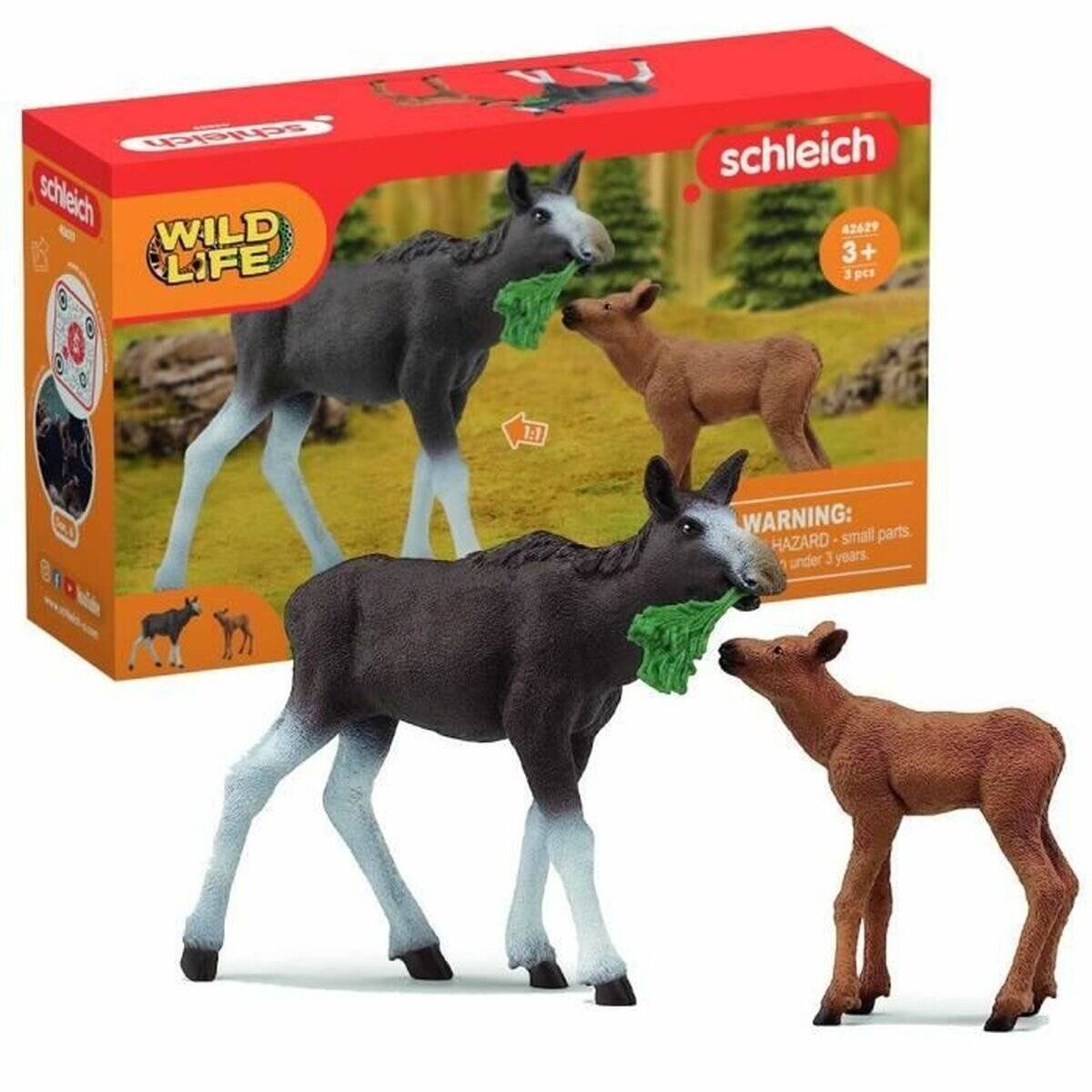 Zwei Schleich Wild Life Spielzeugtiere, ein Elch und ein Kalb, mit der Produktverpackung im Hintergrund.