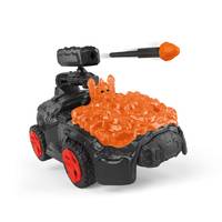 Ein kleiner schwarzer Spielzeugpanzer mit roten Rädern ist mit leuchtend orangener Schleim bedeckt, mit einem kleinen orangefarbenen Geschoss auf einer Kanone.