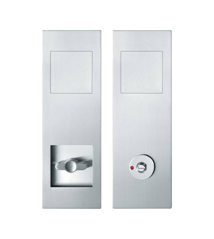 Schlanke vertikale Metallschlösser an Türen; eines mit einem drehbaren Knopf, das andere mit einem kreisförmigen Anzeigeknopf. Das moderne Design unterstreicht die Sicherheit.