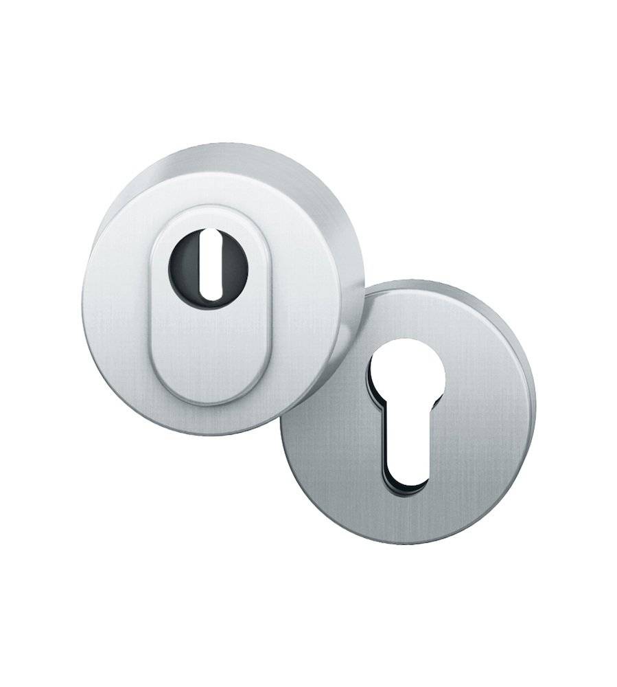 Zwei silberne Schlüssellochrosetten mit ovaler Form, entwickelt für Türschlösser, leicht übereinander angeordnet und zeigen ihre metallische Textur.