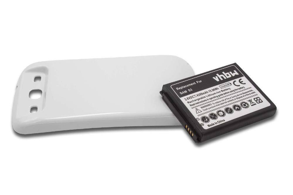 Eine wiederaufladbare vhbw-Batterie und ein weißes elektronisches Gerät, höchstwahrscheinlich ein Ladegerät, liegen nebeneinander. Die Batterie weist gedruckte Spezifikationen auf.