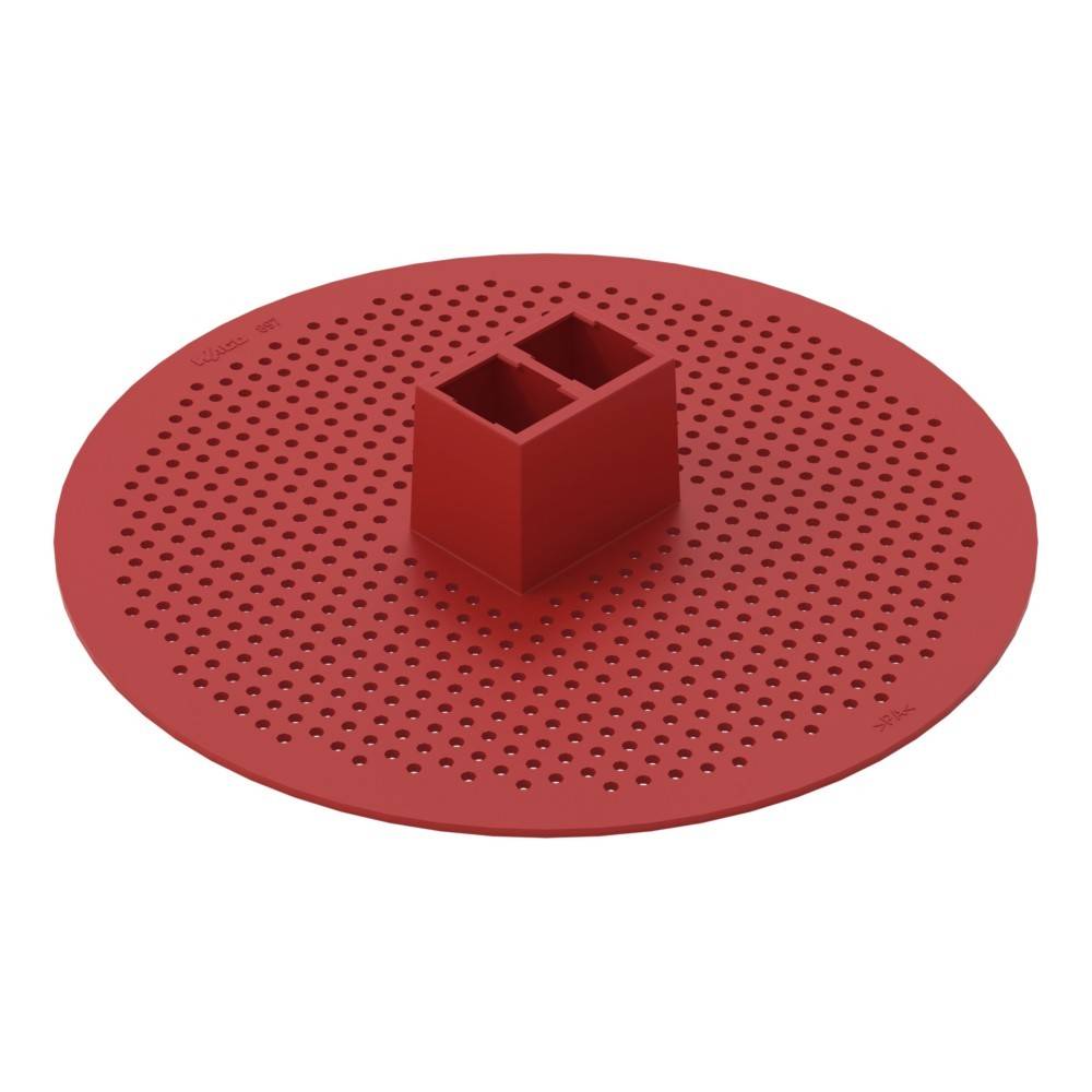 Rote perforierte Kreisscheibe mit zentralem rechteckigem Verbindungsblock, wahrscheinlich ein mechanisches Bauteil oder eine Grundplatte.