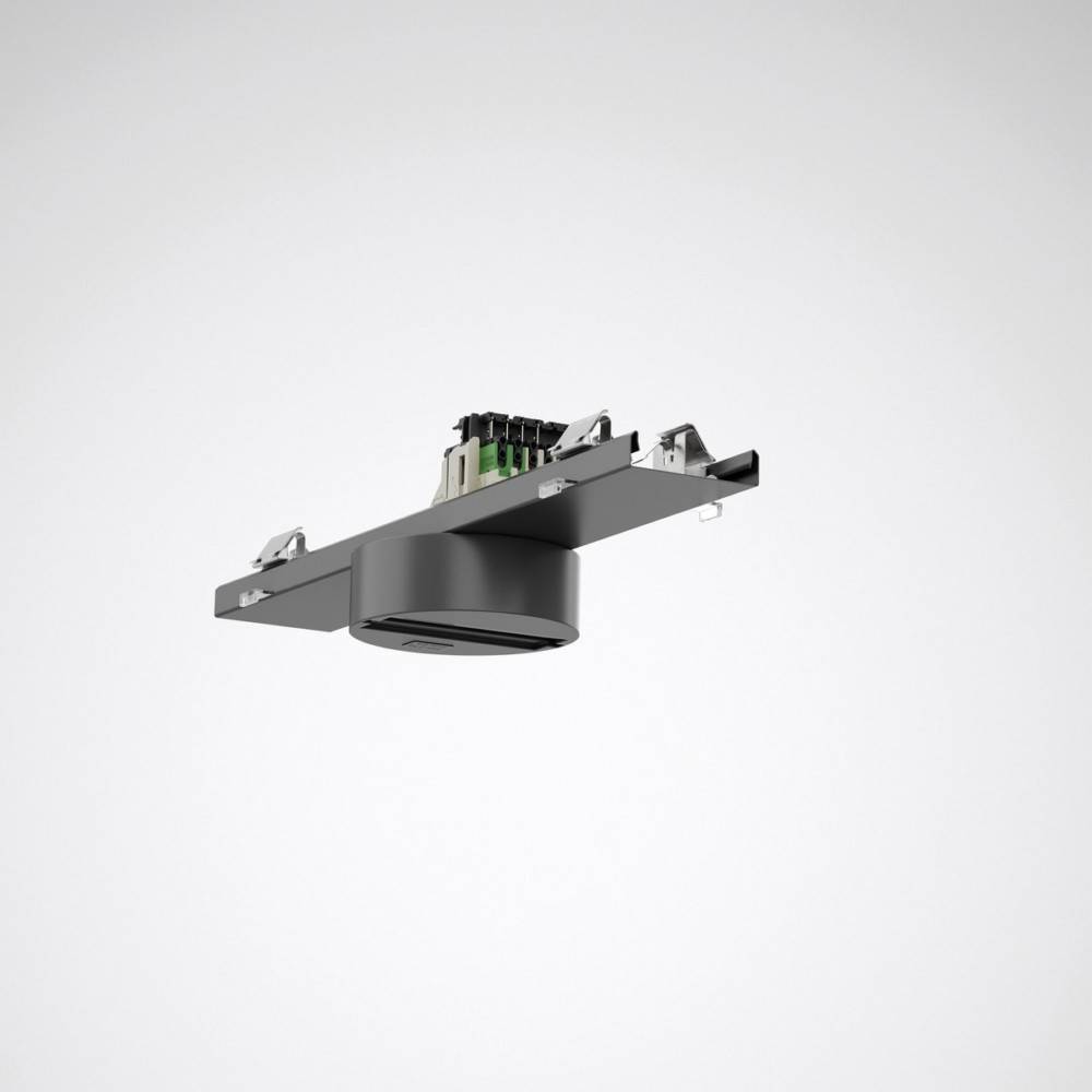 Eine Einbau-Deckenleuchte mit einer kreisförmigen Grundfläche und elektrischen Komponenten oben, die für die Deckeninstallation konzipiert ist.