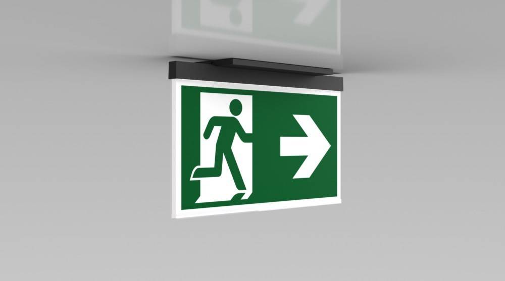 Grünes Notausgangsschild mit einer Figur, die durch eine Tür läuft, und einem Pfeil, der nach rechts zeigt, um die Richtung zum Ausgang anzuzeigen.