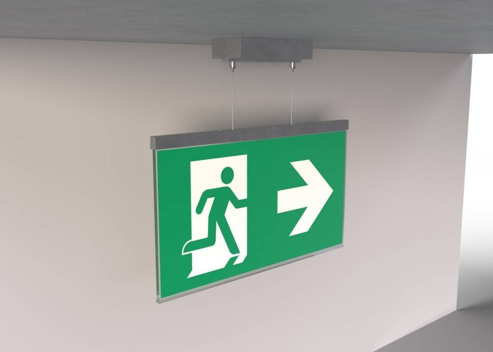 Notausgangsschild mit einer Person, die eine Tür durchschreitet, und einem nach rechts weisenden Pfeil, der die Richtung zum Ausgang anzeigt.