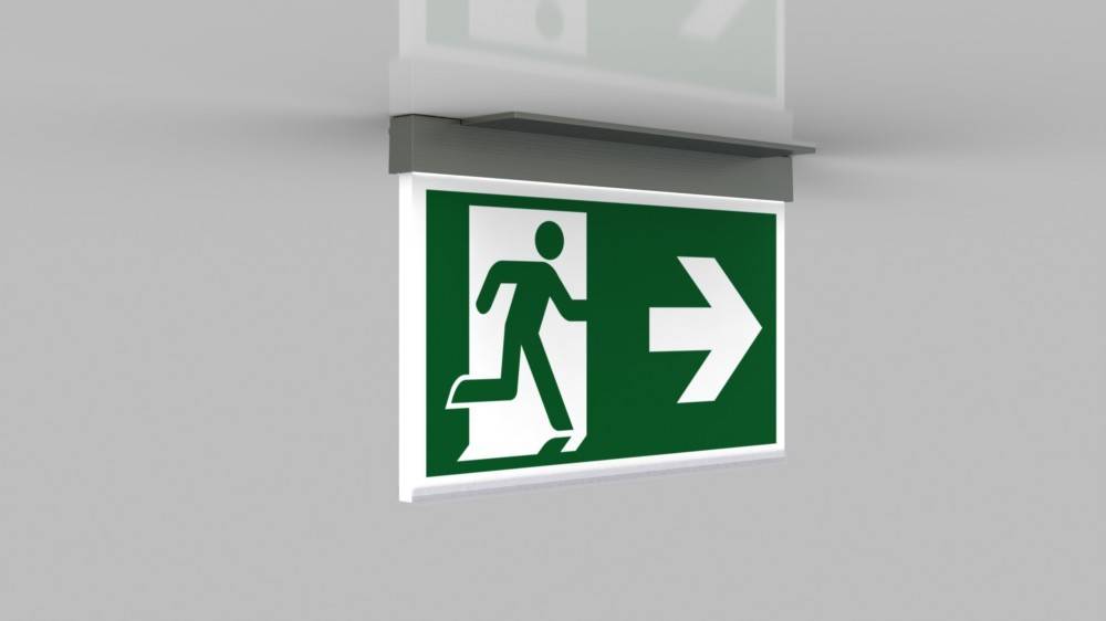 Ein Notausgangsschild mit einer Figur, die durch eine Tür läuft, und einem Pfeil, der nach rechts zeigt und die Richtung zur Evakuierung angibt.